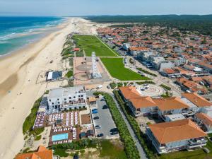 an aerial view of a resort and the beach at Appartement T3 rénové face à la dune, 6 pers., piscine, plage à pied - Biscarrosse - FR-1-319-489 in Biscarrosse