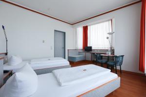 Hotel Blaubeurer Tor客房内的一张或多张床位