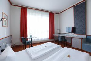 Hotel Blaubeurer Tor客房内的一张或多张床位