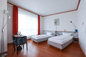 Hotel Blaubeurer Tor客房内的一张或多张床位