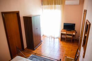 TV a/nebo společenská místnost v ubytování B&B Ulisse