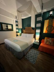 Letto o letti in una camera di CasaBlanca Hotel