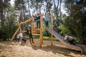 a group of people playing on a playground at Camping du Garlaban in Aubagne