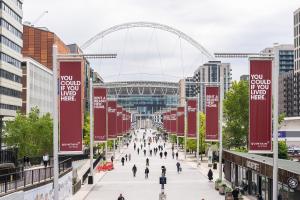 a view of a city with people walking down a street at LiveStay Room with Free Parking in Wembley in London