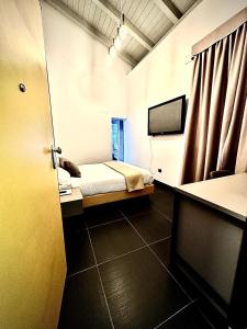Ліжко або ліжка в номері Dazio Exclusive Rooms