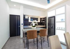 Kuchyň nebo kuchyňský kout v ubytování Instyle Residences at RIZZ SUITES