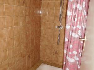 a bathroom with a shower with a shower curtain at Maison spacieuse 6 pers. près plage avec jardin - FR-1-476-204 in La Faute-sur-Mer +8 photos