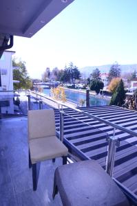 a chair sitting on top of a building at Hotel New York Struga in Struga