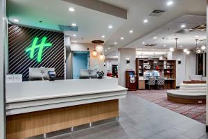 a lobby of a hospital with a reception counter at Holiday Inn Washington-Central/White House, an IHG Hotel in Washington
