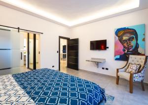 TV a/nebo společenská místnost v ubytování Instyle Residences at RIZZ SUITES