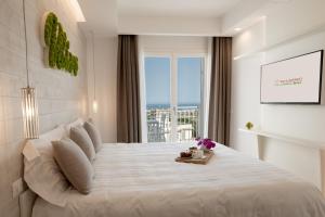 מיטה או מיטות בחדר ב-San Lorenzo Boutique Hotel & SPA