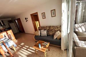 a living room with a couch and a coffee table at AZUL 2 bedroom apartment in Salou Tarragona in Salou