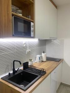 Cucina o angolo cottura di Apartman Enigma