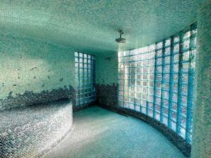 an empty room with a window in a building at Vista Grande Resort - A Gay Men's Resort in Palm Springs