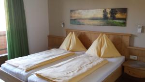 Postel nebo postele na pokoji v ubytování Alpen Apartments Zell am See
