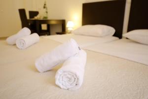 Ein Bett oder Betten in einem Zimmer der Unterkunft Sites Of Zadar Rooms