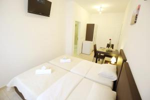 Ein Bett oder Betten in einem Zimmer der Unterkunft Sites Of Zadar Rooms