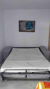 Postel nebo postele na pokoji v ubytování Magnifique vue mer sur baie de Malendure