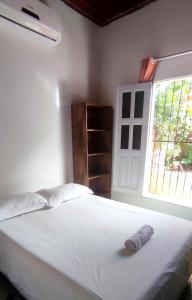 Кровать или кровати в номере Ribeirinhos Hostel