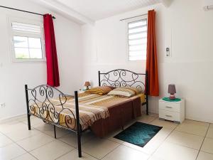 Postel nebo postele na pokoji v ubytování La belle Martinique