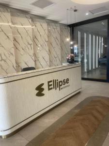 a lobby with a reception desk in a building at Executive Suite at Ellipse in Waterfall Midrand in Midrand +17 photos