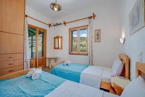 Postel nebo postele na pokoji v ubytování Athina Villas