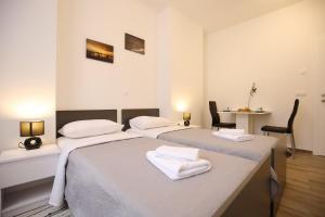Ein Bett oder Betten in einem Zimmer der Unterkunft Sites Of Zadar Rooms