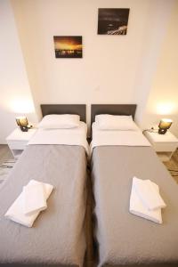 Ein Bett oder Betten in einem Zimmer der Unterkunft Sites Of Zadar Rooms