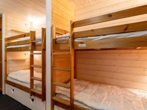 a bedroom with two bunk beds in a cabin at Studio Gourette, 1 pièce, 6 personnes - FR-1-400-5 in Gourette