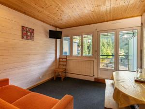 an empty room with a table and chairs and windows at Studio Gourette, 1 pièce, 6 personnes - FR-1-400-5 in Gourette