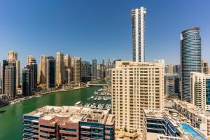 a view of a city with a river and buildings at LUXFolio Retreats - Spacious Luxury Unit - 3BHK in Dubai