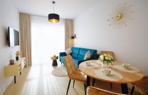 Televízia a/alebo spoločenská miestnosť v ubytovaní Apartament Lux I , Kołobrzeg Aqua Polanki , Baseny , Sauny , Siłownia