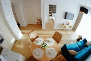 Televízia a/alebo spoločenská miestnosť v ubytovaní Apartament Lux I , Kołobrzeg Aqua Polanki , Baseny , Sauny , Siłownia