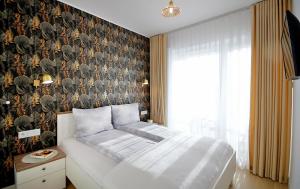 Posteľ alebo postele v izbe v ubytovaní Apartament Lux I , Kołobrzeg Aqua Polanki , Baseny , Sauny , Siłownia + 36 fotografií