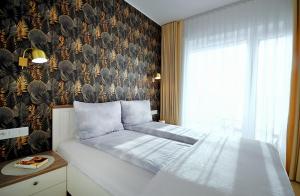 Posteľ alebo postele v izbe v ubytovaní Apartament Lux I , Kołobrzeg Aqua Polanki , Baseny , Sauny , Siłownia