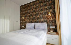 Posteľ alebo postele v izbe v ubytovaní Apartament Lux I , Kołobrzeg Aqua Polanki , Baseny , Sauny , Siłownia