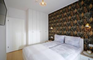 Posteľ alebo postele v izbe v ubytovaní Apartament Lux I , Kołobrzeg Aqua Polanki , Baseny , Sauny , Siłownia