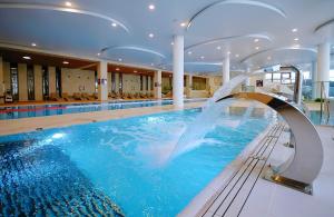 Bazén v ubytovaní Apartament Lux I , Kołobrzeg Aqua Polanki , Baseny , Sauny , Siłownia alebo v jeho blízkosti