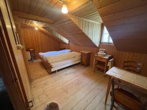 Ένα ή περισσότερα κρεβάτια σε δωμάτιο στο Berghotel Gasterntal
