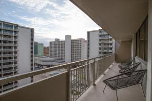 a balcony with a view of the city at Condo Steps Away From Crystal City Metro Station in Arlington