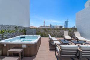 a hot tub on the roof of a building at Beach Walk Boutique Jumeirah in Dubai