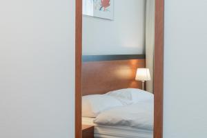 Postel nebo postele na pokoji v ubytování Motel Gottardo Sud