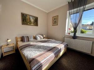 Posteľ alebo postele v izbe v ubytovaní Pension Fortuna