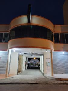 an entrance to a building at night at El Sol Dorado in Tonsupa