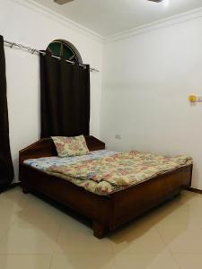 Llit o llits en una habitació de Rafiki Guest House