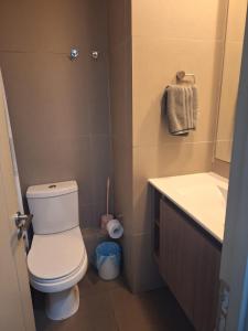 a small bathroom with a toilet and a sink at Alojamiento en la Serena - Chile in La Serena