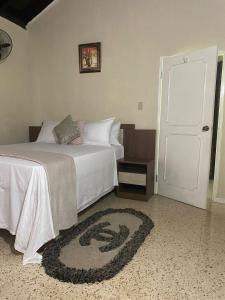מיטה או מיטות בחדר ב-Lachemar Guest House