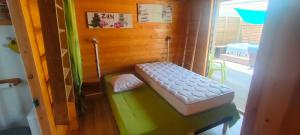 Postel nebo postele na pokoji v ubytování Bungalows créoles
