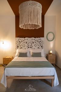 A bed or beds in a room at LA CASA DI ZOE