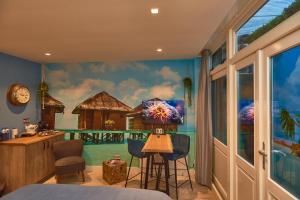 a bedroom with a mural of a resort at Heaven in East B&B in Amsterdam